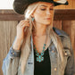 Woman in cowboy hat and turquoise jewelry, STAGECOUCH6.