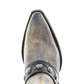 Close-up of gray cowboy boot with studded leather strap