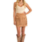 Cowgirl in fringe skirt and cowboy boots