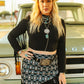 Woman in black top and patterned skirt, T0486-BLK