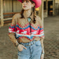 Cowgirl in pink hat and western shirt
