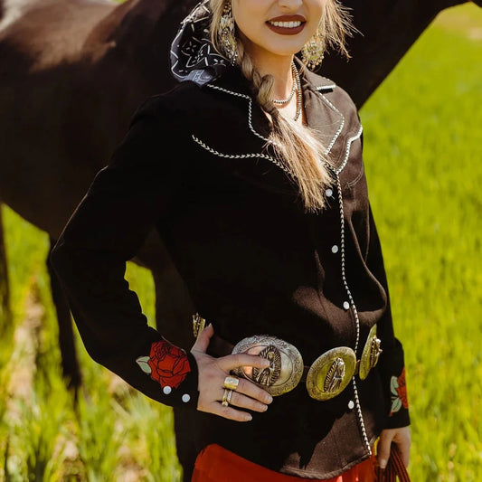 Woman in western wear with horse