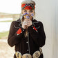 Woman smelling wildflowers, western style.