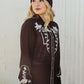 Woman in black floral Western shirt
