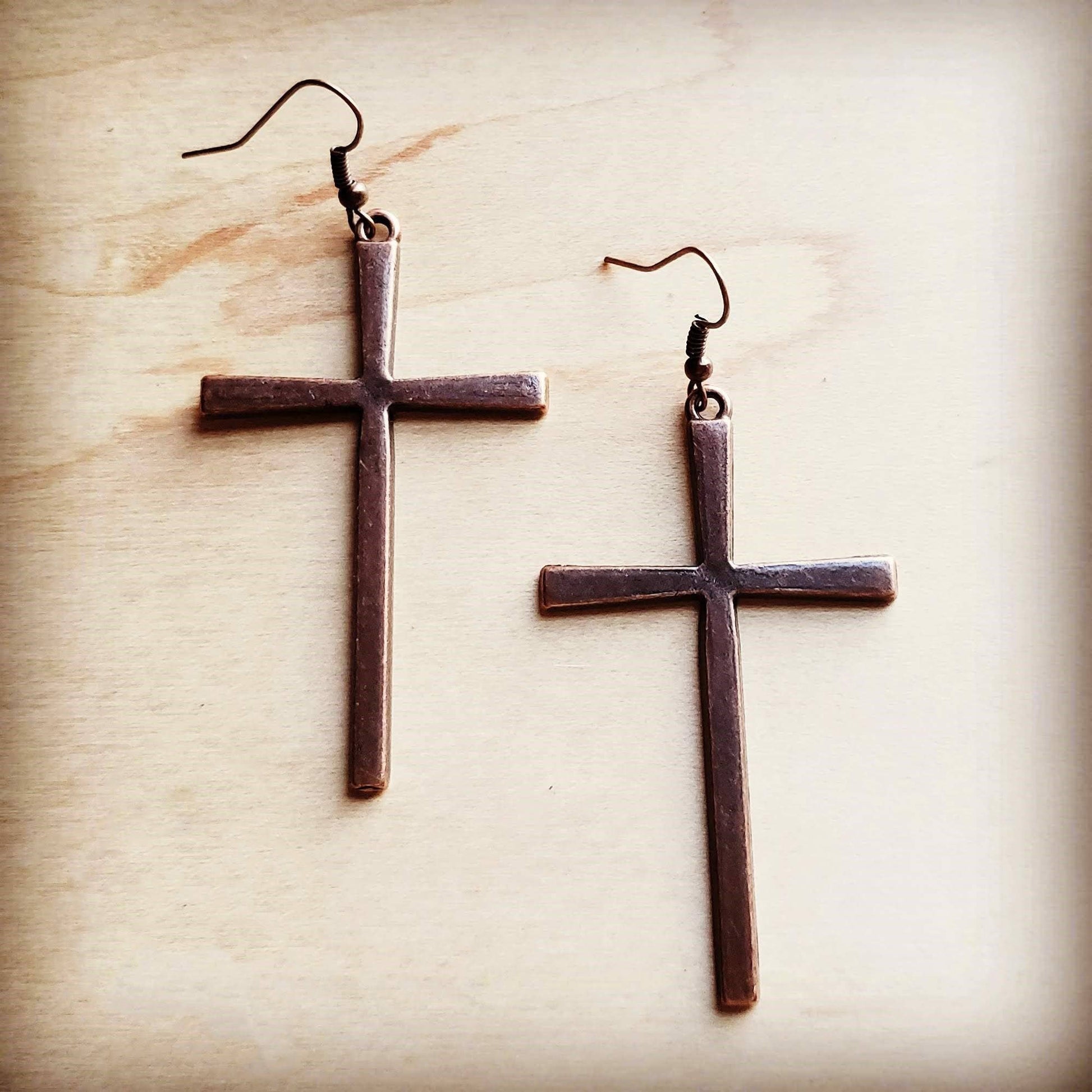 Two bronze cross earrings.