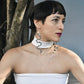 Woman wearing Athena snake earrings