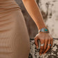 Woman's arm wearing turquoise bracelet and rings (BC5302)