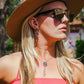 Woman wearing sunglasses, hat, and jewelry - NC4951