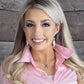 Blonde woman in pink shirt, Bynder temp image NC5301
