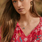 Red catalog necklace on woman