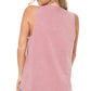Woman in pink tank top and jeans.