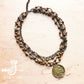 Necklace with beads and pendant.