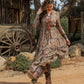 Woman in floral dress and cowboy boots, lifestyle photo