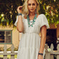 Woman in white dress and turquoise jewelry