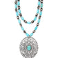 Turquoise stone pendant necklace, close-up view