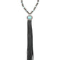 Close-up of beaded necklace with turquoise pendant and black tassel.