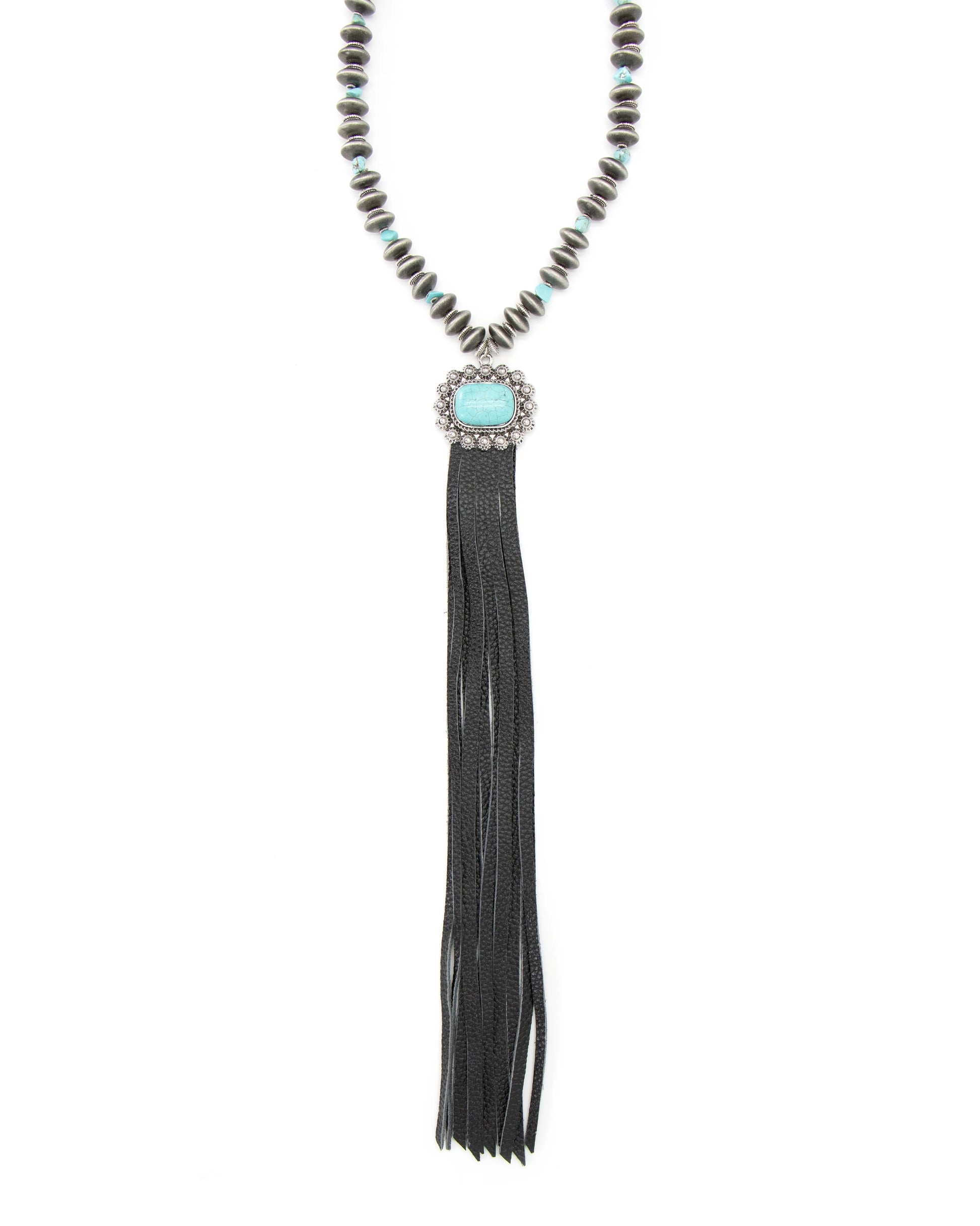Close-up of beaded necklace with turquoise pendant and black tassel.
