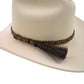 Cowboy hat with braided band and tassel.