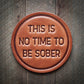 Brown leather coaster with text.