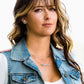Cowgirl necklace on woman in denim vest