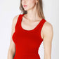 Woman wearing a red tank top.