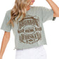 Woman in green t-shirt and white shorts.
