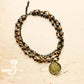Necklace with coin pendant and beaded strands.