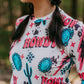 Woman wearing a white shirt with a Howdy print.