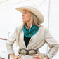 Woman in cowboy hat with jade wild rag scarf