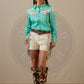 Woman in turquoise shirt and shorts, imgFetch.php-136