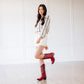 Emma Jane in smoldering ruby boots
