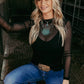 Woman in cowboy hat and jeans, solidmesh top