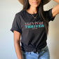 Woman wearing Survivor Thriver shirt