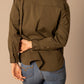 Woman in green shirt and jeans, unnamed-206