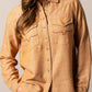 Woman wearing tan button-up shirt (unnamed-222)
