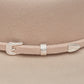 Beige hat with silver buckle detail