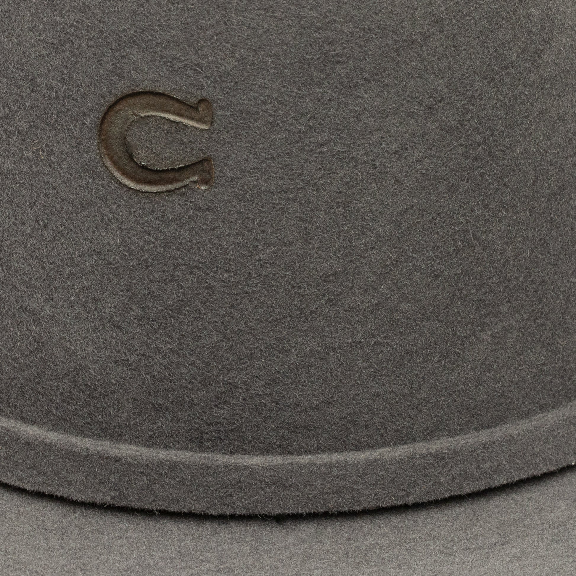 Close-up of gray hat with horseshoe logo, unnamed-273.