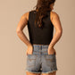Woman in black top and denim shorts, unnamed-322