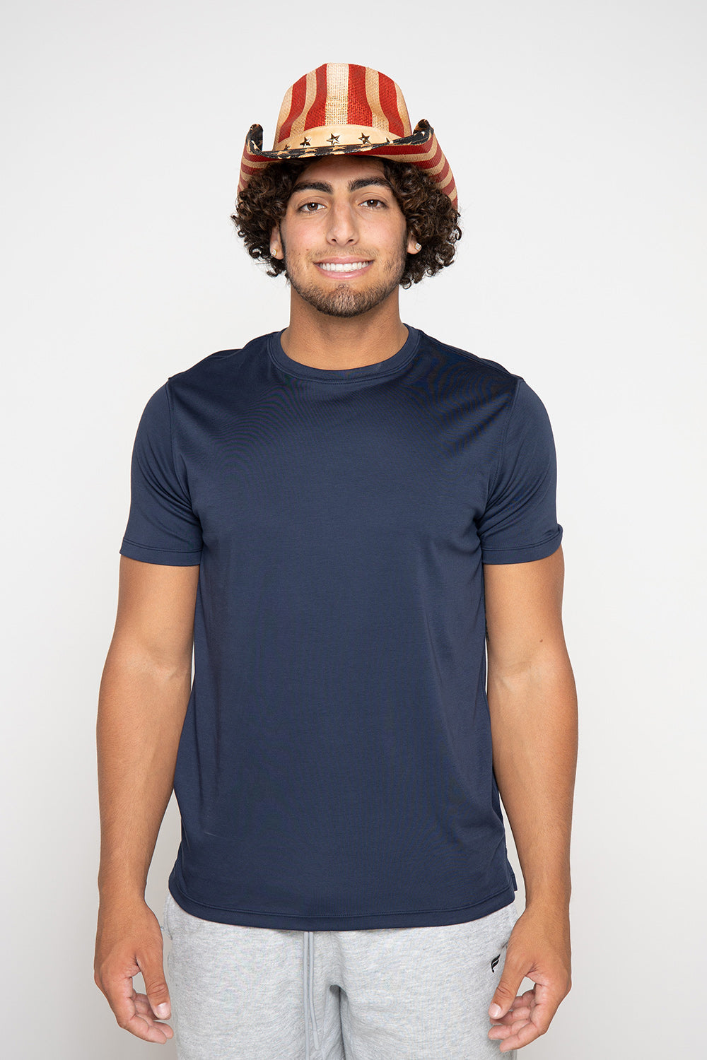 Man in patriotic hat and navy tee