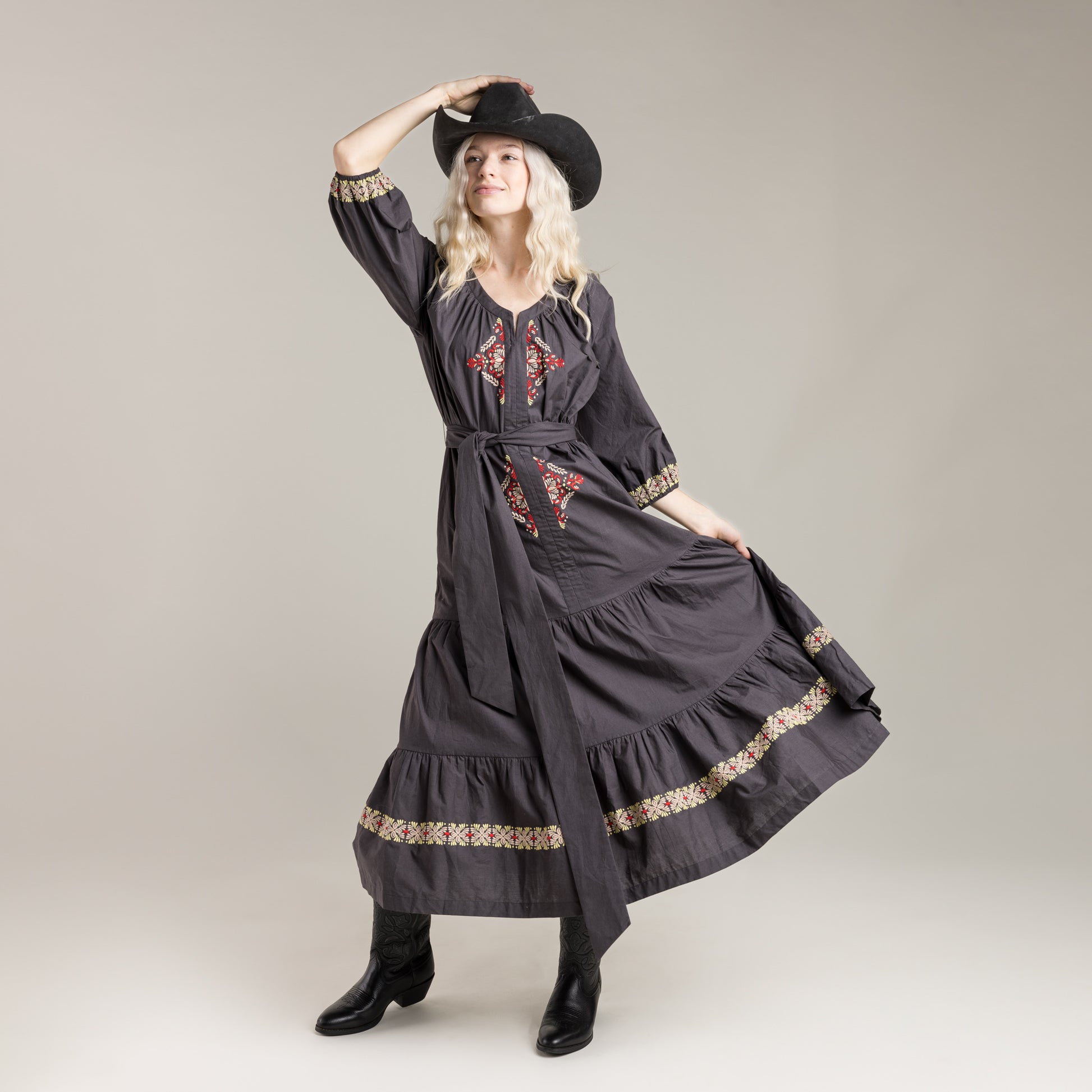 Woman in embroidered dress and hat