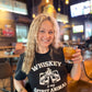 Woman smiling, holding a cocktail, wearing a Whiskey is my spirit animal...