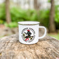 White mug with Bourbon Cowgirl graphic on a tree stump.