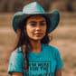 Woman in Wrangler turquoise shirt and cowboy hat
